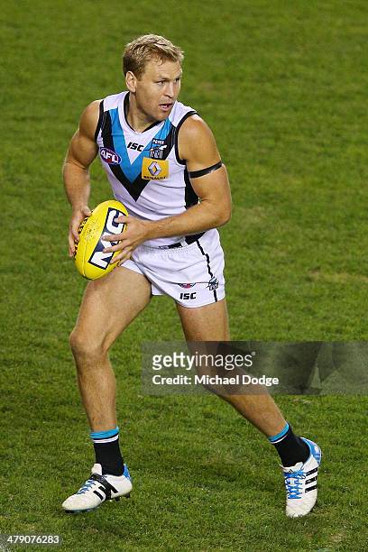 Kane Cornes of the Power runs with the ball during the round one AFL match between the Carlton Blues v Port Adelaide Power at Etihad Stadium on March...