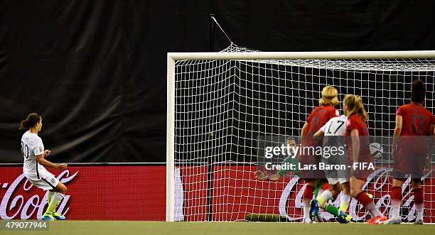 Carli Lloyd of USA scores her teams first goal during the FIFA Women's World Cup 2015 Semi Final match between USA and Germany at Olympic Stadium on...