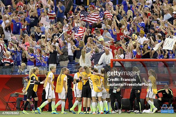 The United States sideline celebrates after Carli Lloyd scores on a penalty kick in the second half against Germany in the FIFA Women's World Cup...
