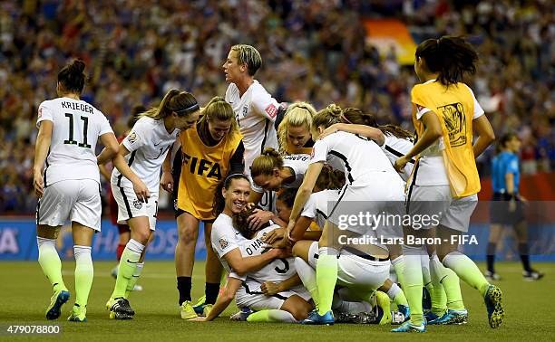 Kelly O'Hara of USA and her team mates celebrate after winning the FIFA Women's World Cup 2015 Semi Final match between USA and Germany at Olympic...