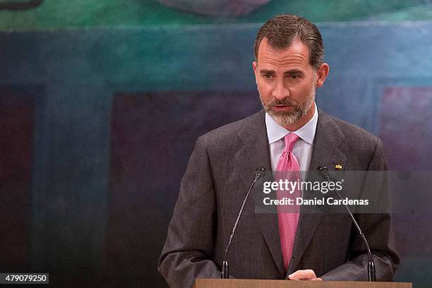 King Felipe VI of Spain gives a speech during a visit to the Universidad Nacional at UNAM's Simon Bolivar Amphiteatre on June 30, 2015 in Mexico...