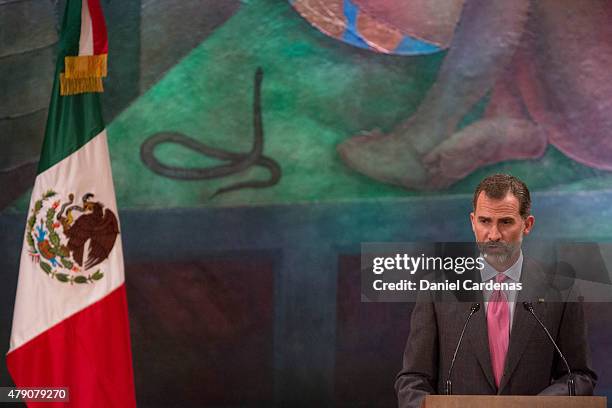 King Felipe VI of Spain gives a speech during a visit to the Universidad Nacional at UNAM's Simon Bolivar Amphiteatre on June 30, 2015 in Mexico...
