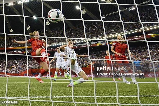 Kelley O'Hara of the United States scores the second goal past Tabea Kemme of Germany in the FIFA Women's World Cup 2015 Semi-Final Match at Olympic...