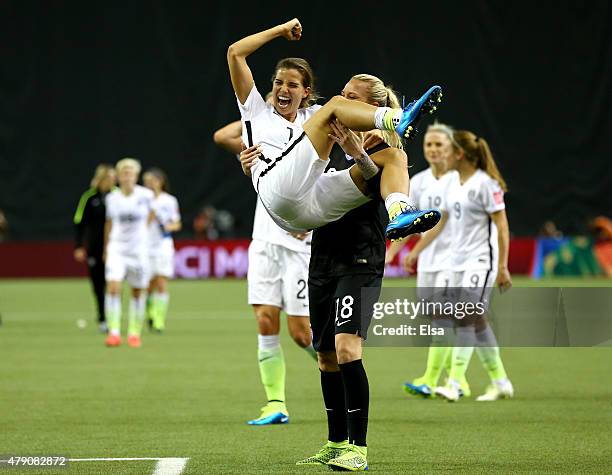 Tobin Heath celebrates with Ashlyn Harris of the United States after the 2-0 victory against Germany in the FIFA Women's World Cup 2015 Semi-Final...