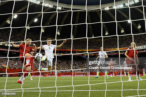 Kelley O'Hara of the United States scores the second goal past Tabea Kemme of Germany in the FIFA Women's World Cup 2015 Semi-Final Match at Olympic...