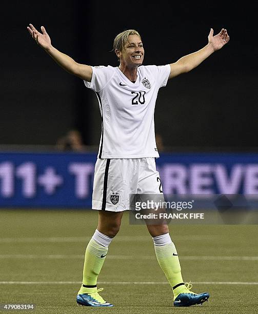 Forward Abby Wambach celebrates after winning the semi-final football match between USA and Germany during their 2015 FIFA Women's World Cup at the...