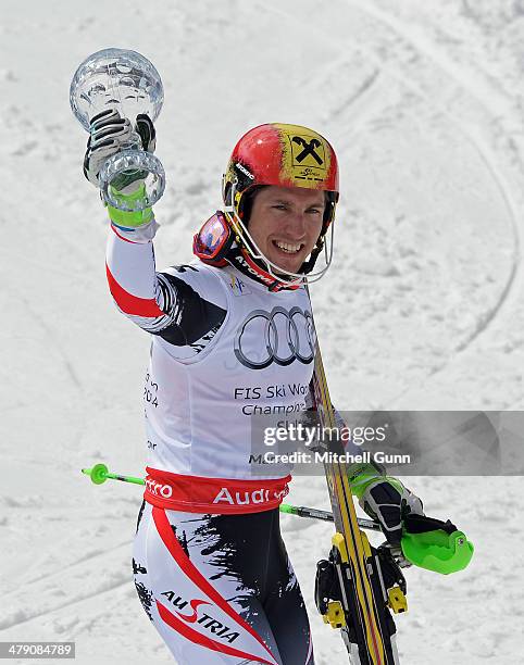 Marcel Hirscher of Austria poses with the crystal globe for the overall title in the Audi FIS Alpine Skiing World Cup Finals Slalom on March 16, 2014...