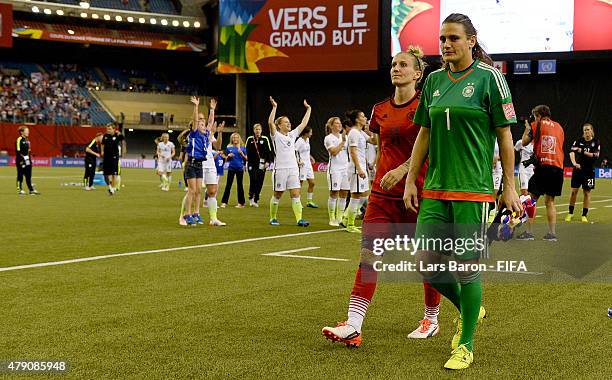 Anja Mittag of Germany and Nadine Angerer of Germany are looking dejected after loosing the FIFA Women's World Cup 2015 Semi Final match between USA...