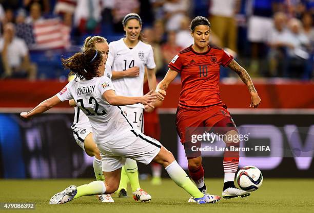 Lauren Holiday of USA challenges Dzsenifer Marozsan of Germany during the FIFA Women's World Cup 2015 Semi Final match between USA and Germany at...