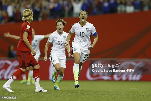 Carli Lloyd of USA celebrates scoring from the penalty spot during the FIFA Women's World Cup 2015 semi final match between USA and Germany at...