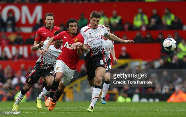 Rafael da Silva of Manchester United in action with Steven Gerrard of Liverpool during the Barclays Premier League match between Manchester United...