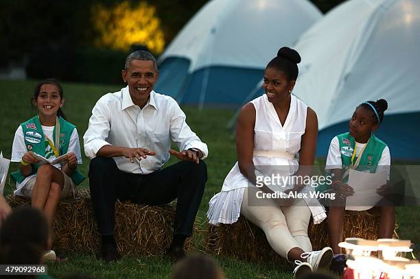 President Barack Obama and first lady Michelle Obama , flanked by Daphnye Shell of Peggs, Oklahoma, and Kennedi Pridget of Maryland, particiapte in...