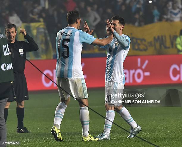 Argentina's forward Lionel Messi and defender Martin Demichelis celebrate after beating Paraguay 6-1 in their Copa America semifinal football match...