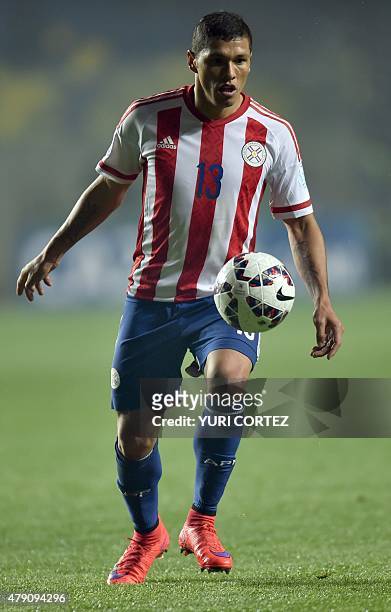 Paraguay's midfielder Richard Ortiz controls the ball during their Copa America semifinal football match against Argentina in Concepcion, Chile on...
