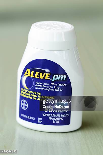 aleve pain reliever and sleep aid medicine - aleve pill stock pictures, royalty-free photos & images