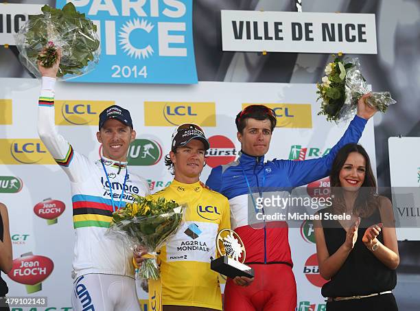 Carlos Betancur Gomez of Colombia and AGR La Mondiale overall winner of the race and yellow jersey alongside second placef Rui Costa of Portugal and...
