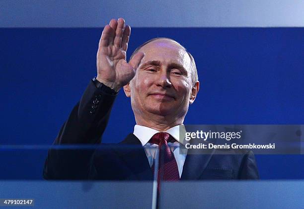 Russia President Vladimir Putin waves during the Sochi 2014 Paralympic Winter Games Closing Ceremony at Fisht Olympic Stadium on March 16, 2014 in...