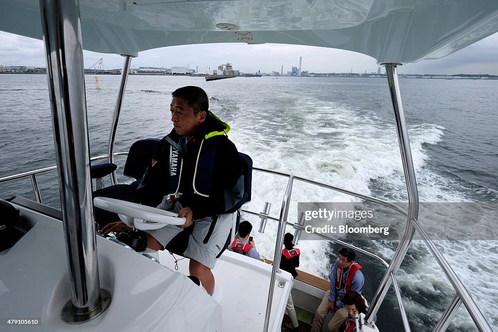 Yamaha Motor Co. Marine Unit Head Hirofumi Usui And The company's Big Boat As Americans Buying Big Boats To Help Yamaha Hit 30% Profit Margins