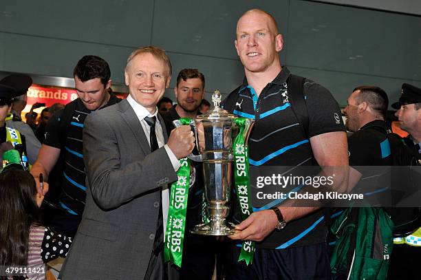 Ireland head coach Joe Schmidt and Irish captain Paul O'Connell of the Ireland RBS Six Nations Rugby Championship winners 2014 arrive home at the...