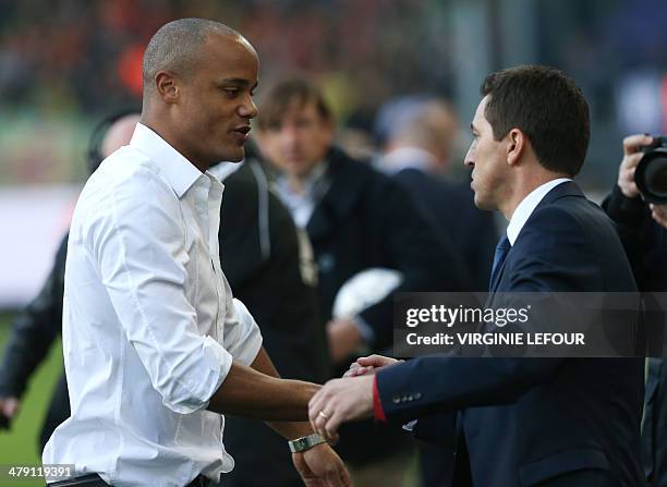 Former Anderlecht player Vincent Kompany and Anderlecht's coach Besnik Hasi shake hands prior to the Jupiler Pro League match between RSC Anderlecht...