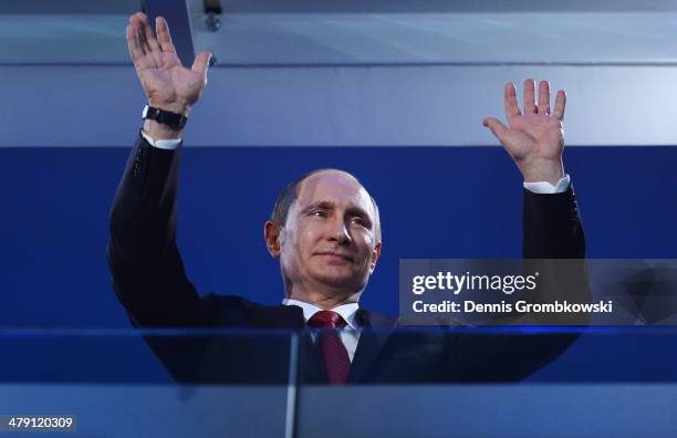 Russia President Vladimir Putin waves during the Sochi 2014 Paralympic Winter Games Closing Ceremony at Fisht Olympic Stadium on March 16, 2014 in...