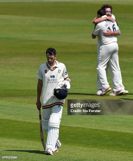 Durham batsman Graham Onions walks off as Yorkshire bowler Ryan Sidebottom and Tim Bresnan celebrate after the final Durham wicket is taken and...