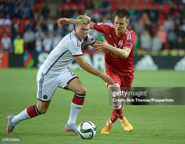 Jonas Knudsen of Denmark is challenged by Felix Klaus of Germany during the UEFA European Under-21 Group A match between Germany and Denmark at Eden...