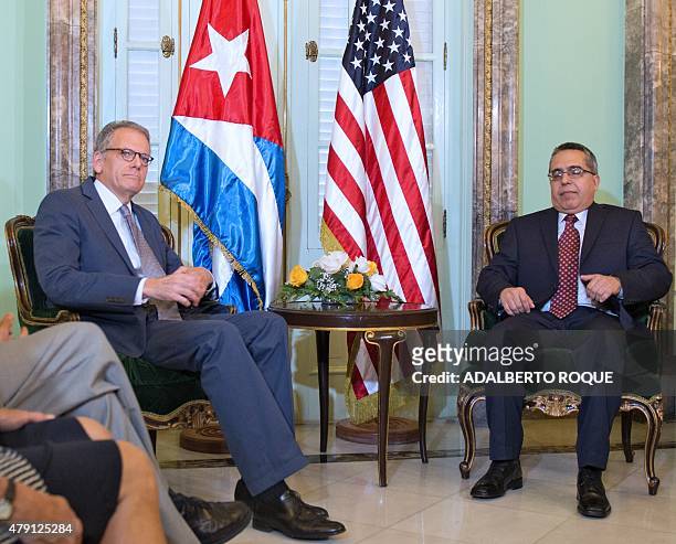 The head of US Interest Section, Jeffrey DeLaurentis , talks with Cuban Foreign Vice-Minister Marcelino Medina, after giving him a letter from US...
