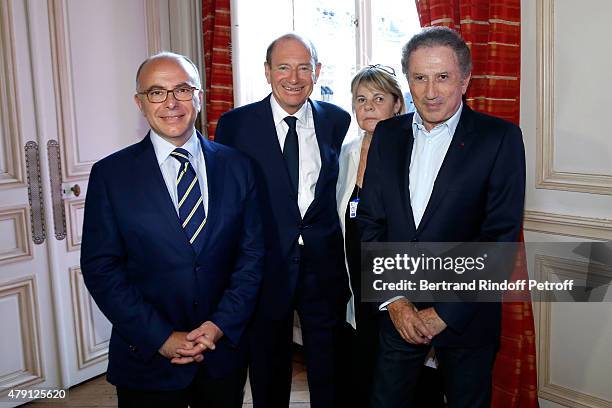 French "Ministre de l'Interieur" Bernard Cazeneuve, Producer Tim Newman, Producer Dominique Cantien and Presenter of the show Michel Drucker attend...