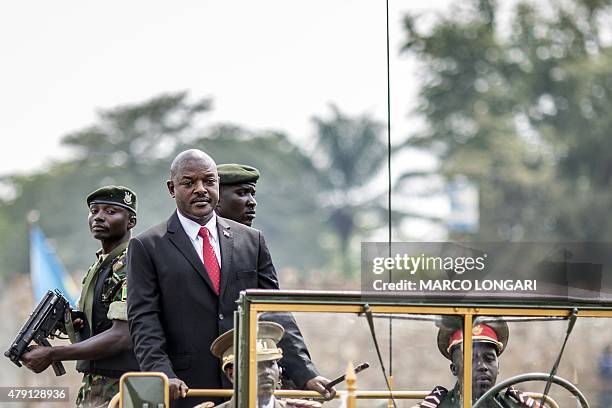 Burundi's President Pierre Nkurunziza arrives in a car for celebrations of the country's 53rd Independence Anniversary at Prince Rwagasore Stadium in...