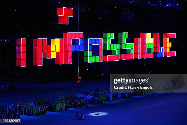 Aleksey Chuvashev, a rowing Paralympian, climbs a rope using just his hands to set off fireworks during the Closing Ceremony of the 2014 Paralympic...