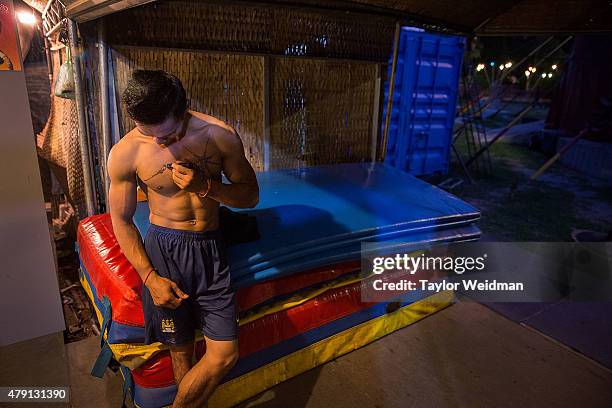 Cambodian circus artist prepares for a show on July 1, 2015 at Phare - The Cambodian Circus in Siem Reap, Cambodia. Phare Ponleu Salpak is an...
