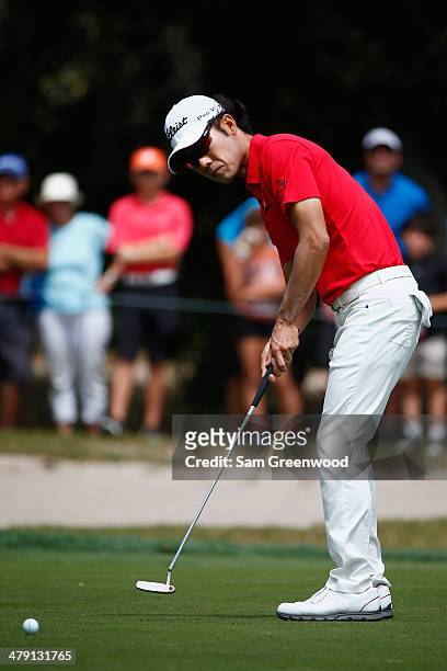 Kevin Na of South Korea putts on the 2nd green during the final round of the Valspar Championship at Innisbrook Resort and Golf Club on March 16,...