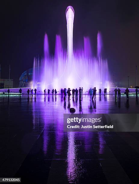 Spectators watch a fountain display following the Closing Ceremony of the 2014 Paralympic Winter Games on March 16, 2014 in Sochi, Russia.