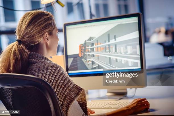 female architect working on computer - over the shoulder view stock pictures, royalty-free photos & images