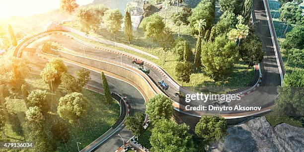 open-wheel single-seater racing car racing cars on the track - motor racing track stock pictures, royalty-free photos & images