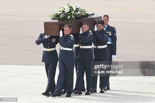 The coffin of Stephen Mellor, one of the victims of last Friday's terrorist attack, is taken from the RAF C-17 aircraft at RAF Brize Norton in...