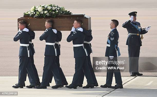 The coffin of John Stollery, one of the victims of last Friday's terrorist attack, is taken from the RAF C-17 aircraft at RAF Brize Norton in...
