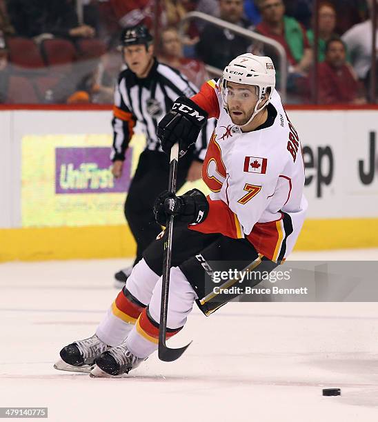 Brodie of the Calgary Flames skates against the Phoenix Coyotes at the Jobing.com Arena on March 15, 2014 in Glendale, Arizona. The Coyotes defeated...