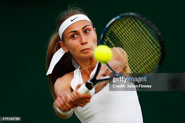 Aleksandra Krunic of Serbia plays a backhand in her Ladies Singles Second Round match against Sara Errani of Italy during day three of the Wimbledon...