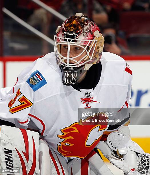 Joni Ortio of the Calgary Flames tends net against the Phoenix Coyotes at the Jobing.com Arena on March 15, 2014 in Glendale, Arizona. The Coyotes...