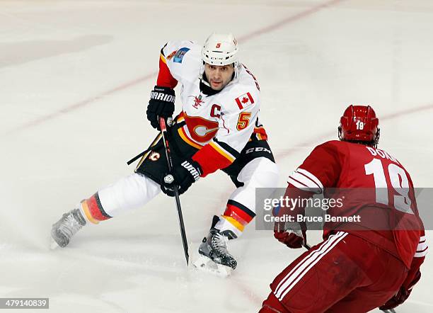 Mark Giordano of the Calgary Flames skates against the Phoenix Coyotes at the Jobing.com Arena on March 15, 2014 in Glendale, Arizona. The Coyotes...
