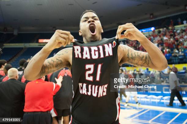 Shawn Long of the Louisiana Lafayette Ragin Cajuns celebrates after defeating the Georgia State Panthers in the first overtime during the...