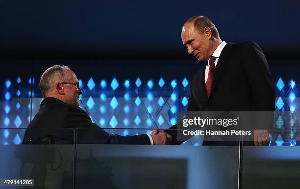 Russia President Vladimir Putin shakes hands with International Paralympic Committee President Sir Philip Craven during the Sochi 2014 Paralympic...