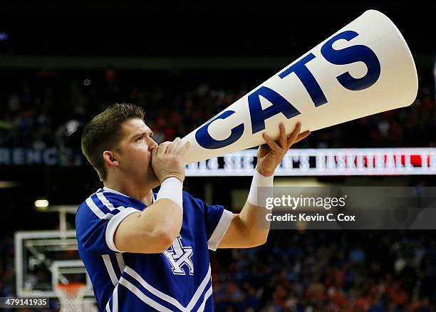 Kentucky Wildcats cheerleader performs in th first half against the Florida Gators during the Championship game of the 2014 Men's SEC Basketball...