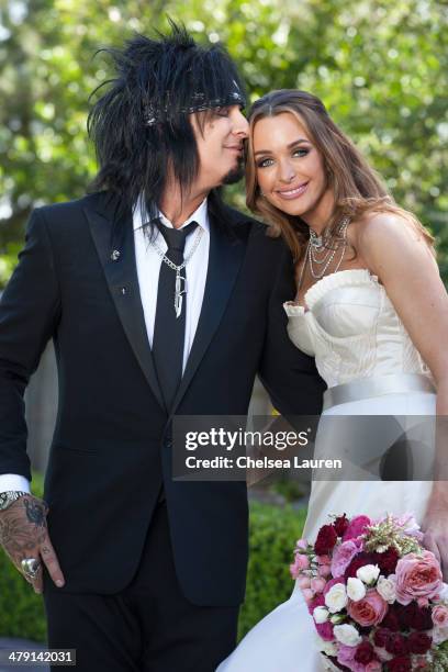 Nikki Sixx and Courtney Sixx pose for portraits during their wedding at Greystone Mansion on March 15, 2014 in Beverly Hills, California.