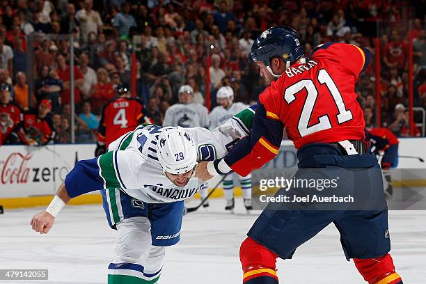 Krys Barch of the Florida Panthers and Tom Sestito of the Vancouver Canucks fight during first period action at the BB&T Center on March 16, 2014 in...