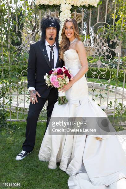 Nikki Sixx and Courtney Sixx pose for portraits during their wedding at Greystone Mansion on March 15, 2014 in Beverly Hills, California.