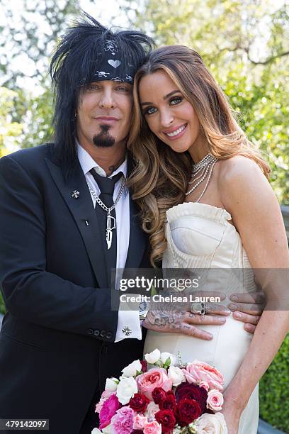 Nikki Sixx and Courtney Sixx pose for portraits during their wedding at Greystone Mansion on March 15, 2014 in Beverly Hills, California.