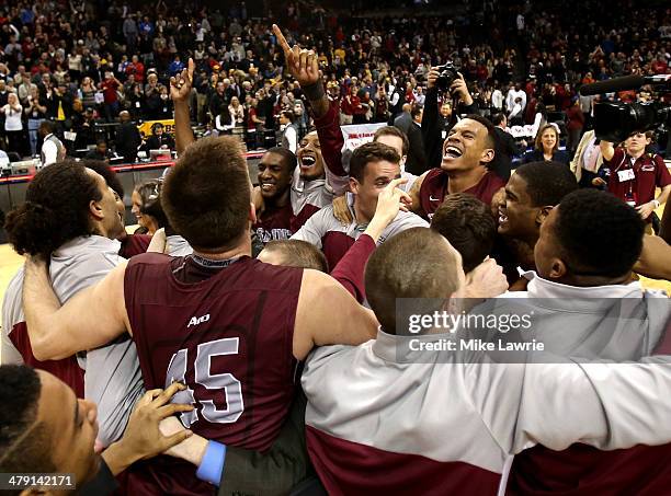 The Saint Joseph's Hawks celebrate after defeating the Virginia Commonwealth Rams during the Championship game of the 2014 Atlantic 10 Men's...